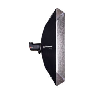 Elinchrom_Rotalux_Stripbox_50x130cm_003 Side view of the Elinchrom Rotalux Stripbox 50x130cm studio luminaire with black outer shell and silver reflective interior, mounted on a luminaire unit against a white background.