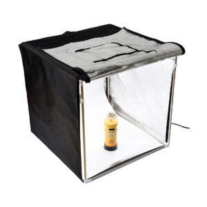 Godox_LST40_006 Godox LST40 - Photo tent, a portable light box with black fabric sides and reflective silver interior, is set up with a front opening and displays the honey bottle inside for photography.