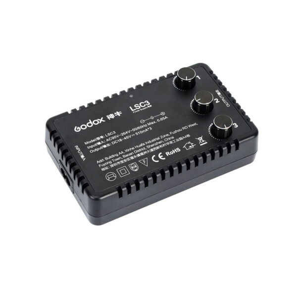 Godox_LST40_017 The black Godox LST40 - Photo Tent lighting control unit with three numbered control wheels, specification label and side vents is shown on a white background.