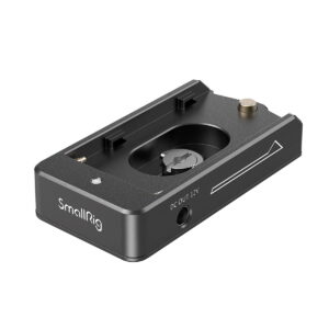 The SmallRig 3095 NP-F Battery Adapter Plate Lite with NP-FZ100 Dummy Battery is a black camera accessory with a central mounting screw, 12V DC output socket and arrow symbol, designed for camera rig assembly.