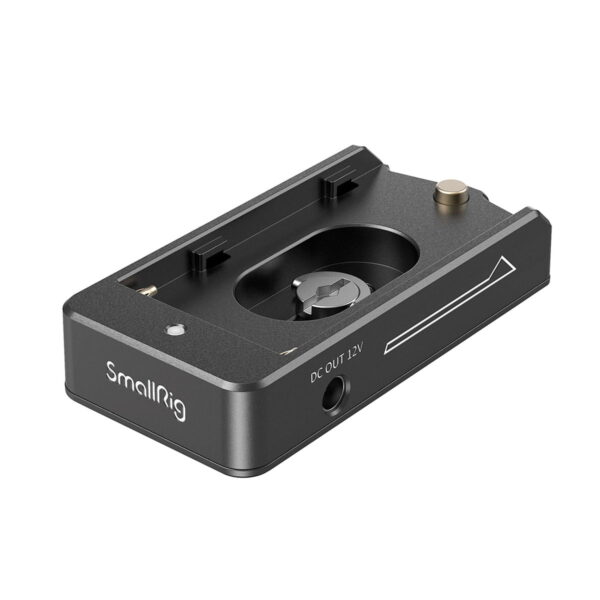 The SmallRig 3095 NP-F Battery Adapter Plate Lite with NP-FZ100 Dummy Battery is a black camera accessory with a central mounting screw, 12V DC output socket and arrow symbol, designed for camera rig assembly.