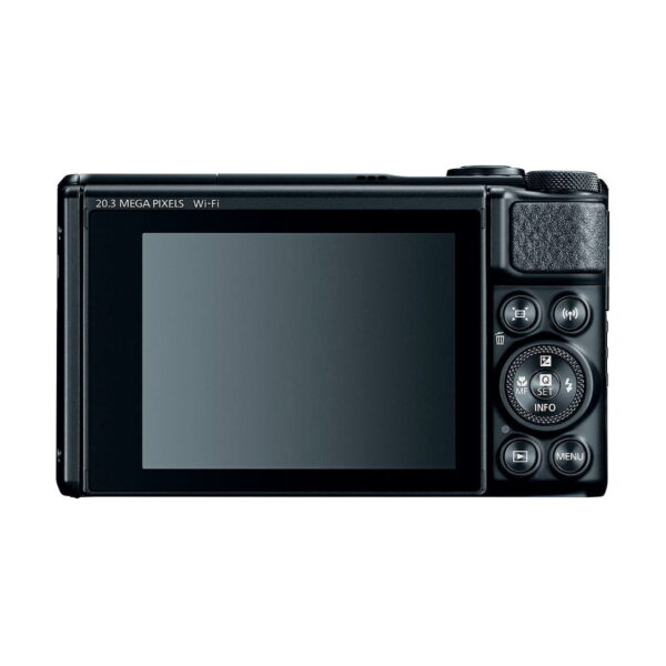 The Canon PowerShot SX740 HS compact camera is visible from the rear, with a large screen and a number of control buttons on the right, including an orientation button, menu button and textured grip area.
