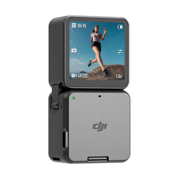 The grey DJI Action 2 Dual-Screen Combo action camera has a folding screen and shows footage of a woman running across rocky terrain under a blue sky, combining compact size with a simple, modern design.