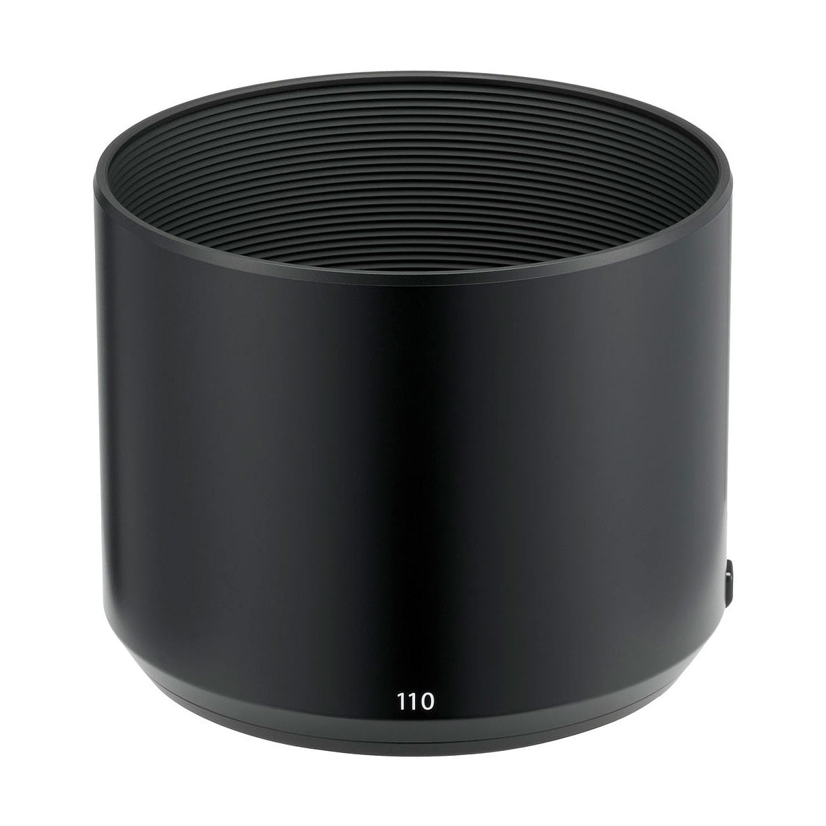 Large, black, cylindrical Fujifilm Fujinon GF 110mm f/2 R LM WR lens hood with ribbed inner surface and "110" printed in white on the bottom.