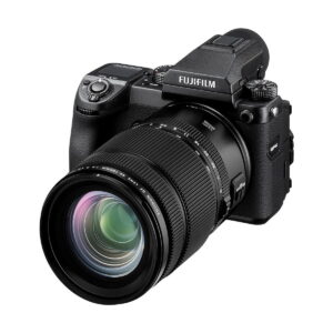 The Fujifilm Fujino GF 45-100mm f/4 R LM OIS WR is photographed in black, with the zoom lens, buttons, viewfinder and branding on a white background.
