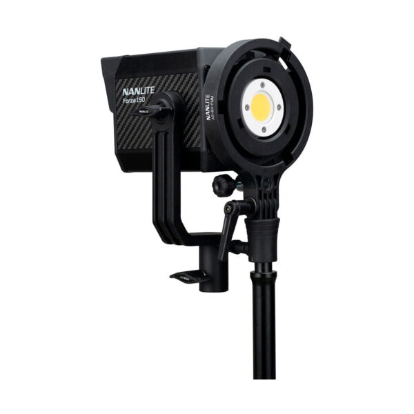 Nanlite_Forza_150_008 The NANLITE Forza 150 Led Monolight LED light is mounted on a stand, viewed from the side against a white background. The luminaire has a round front and a rectangular body with the model name visible.