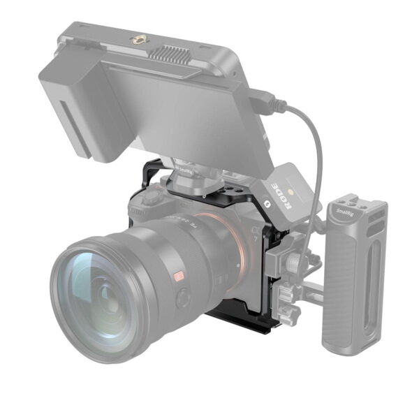 The SmallRig 3667 Full Cage for Sony A7R V / A7R IV / A7 IV / A7S III / A1 is shot with a Sony camera with a large lens, external monitor, wireless Rode receiver and side handle on a white background.