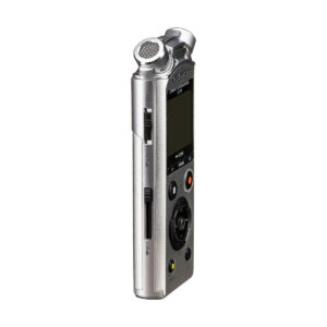 Olympus_LS-P1_0004 The Olympus LS-P1 audio recorder, a compact silver device with a display, several buttons, a built-in microphone at the top and memory card slots at the side, is pictured vertically on a white background.