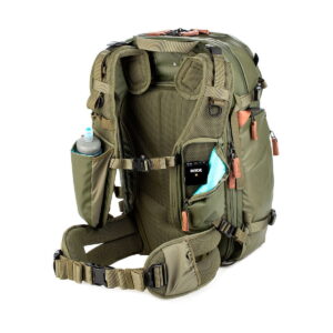 Shimoda Designs Explore v2 25 Starter Kit Camera Backpack, green, shown from the back, with padded straps, waist belt, mesh back panel, side pockets for water bottle and accessories and brown zipper pulls.