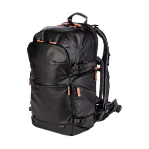 The Shimoda Designs Explore v2 35 camera backpack in black features multiple zippered compartments, brown zipper pulls, padded shoulder straps and a waist belt - ideal for travel or outdoor use.