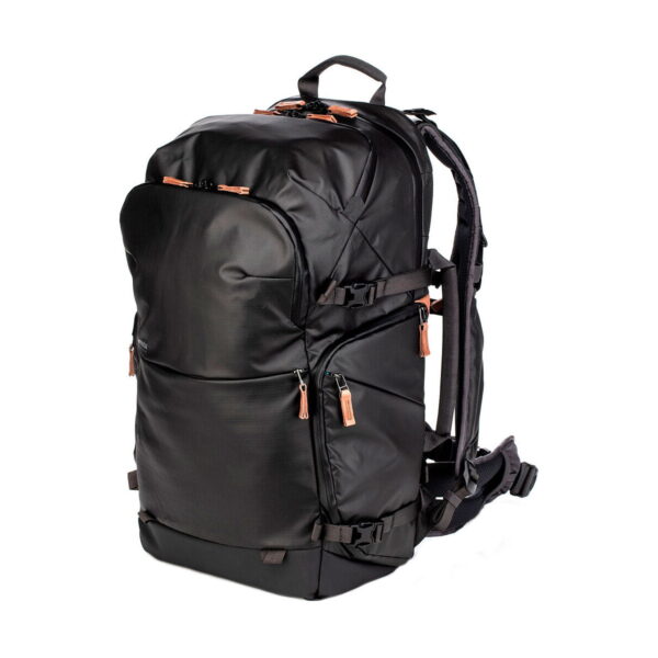 The Shimoda Designs Explore v2 35 camera backpack in black features multiple zippered compartments, brown zipper pulls, padded shoulder straps and a waist belt - ideal for travel or outdoor use.