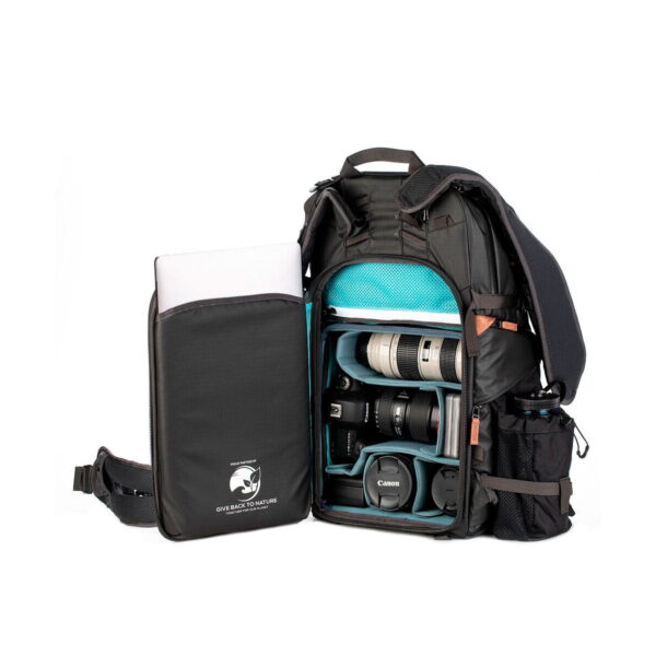 The Shimoda Designs Explore v2 35 camera backpack, black, is open and shows organized compartments for camera bodies, lenses and accessories. A laptop fits in the front pocket, and the side pockets hold small items or a water bottle.