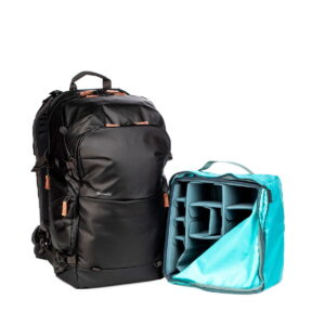 The Shimoda Designs Explore v2 35 camera backpack, black sits next to a removable light blue padded camera with multiple adjustable compartments.