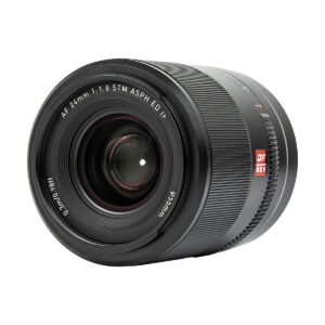 A close-up of the Viltrox AF 24mm f/1.8 lens, Nikon Z shows its black body, front ring with AF 24mm 1:1.8 STM ASPH ED IF markings, visible glass elements and textured focus ring.