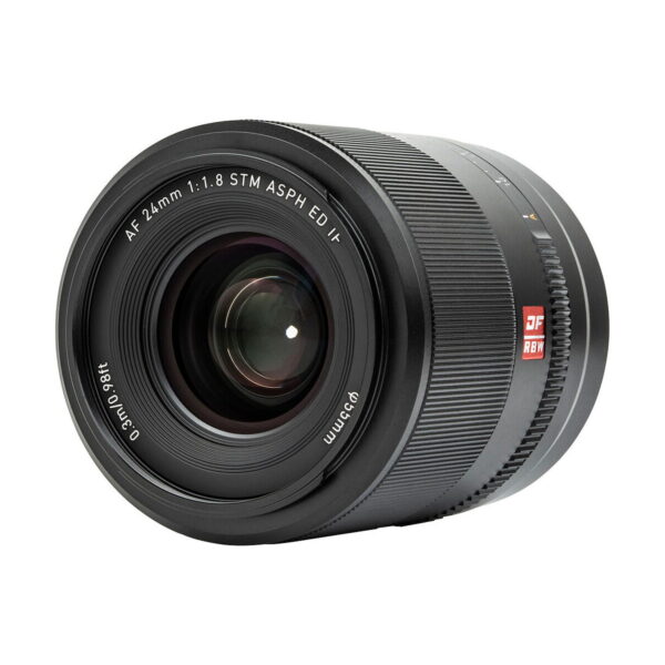 A close-up of the Viltrox AF 24mm f/1.8 lens, Nikon Z shows its black body, front ring with AF 24mm 1:1.8 STM ASPH ED IF markings, visible glass elements and textured focus ring.