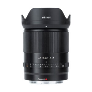 The Viltrox AF 24mm f/1.8 lens, Nikon Z, with black body, ribbed focus ring, aperture markings and petal-shaped backlight protection, is shown upright against a white background.