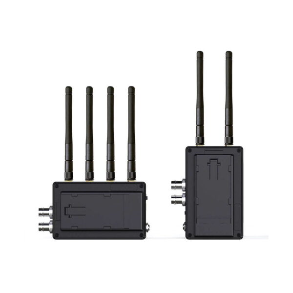 Swit_Flow2000_Tx_Rx_Wireless_SDI_HDMI_Kit_003 Swit Flow2000 Tx+Rx Wireless SDI/HDMI Kit sisältää kaksi mustaa yksikköä, joissa kummassakin on neljä korkeaa antennia ja useita sivuportteja, kuvassa edestä ja sivulta valkoista taustaa vasten.