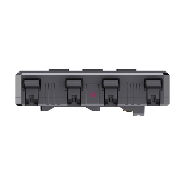 Etukuva Accsoon CineView Quad Transmission HDMI/SDI -laitteesta, harmaa suorakulmainen laite, jossa on neljä mustaa salpaa ja keskellä virtapainikkeen kuvake, eristettynä valkoiselle taustalle.