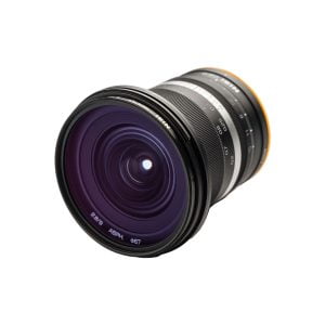 The NiSi 9mm F2.8 - Fuji X is a wide-angle camera lens with a large glass front, black body, focus and zoom rings and printed specifications isolated on white.