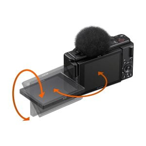 Sony ZV-1F -kompaktikamera on esitetty mustana, ja sen päällä on sumea mikrofoni, ja oranssit nuolet korostavat ulos käännettävän näytön pyörivää ja kallistettavaa liikettä.