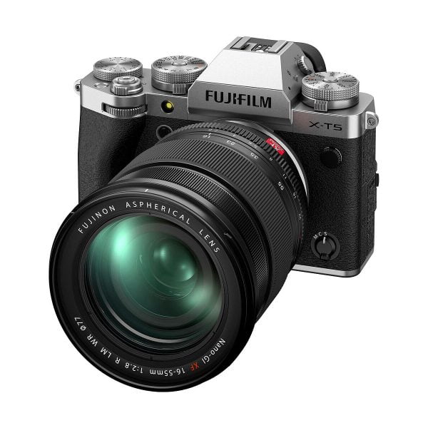 A silver Fujifilm X-T5 system camera with a large aspherical lens attached is shown diagonally against a white background.