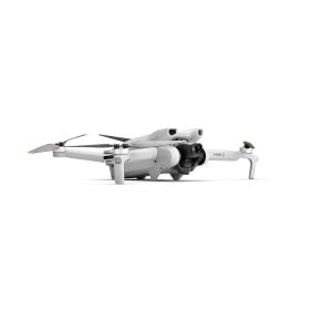 The DJI Mini 3 + Smart Controller is a compact white quadcopter with four propellers and a front-facing camera, marked MINI 3 and photographed on a flat surface against a white background.