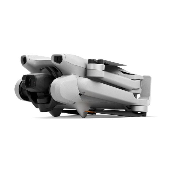 The compact grey DJI Mini 3 + Smart Controller is pictured folded for storage, with the camera and propeller arms neatly against the body on a white background.