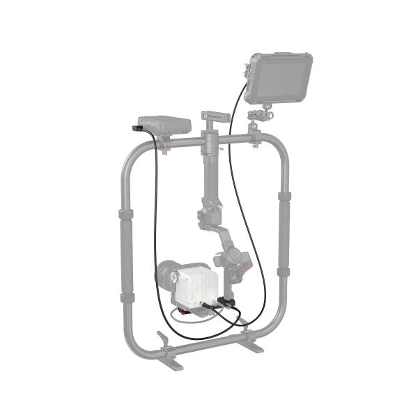 The SmallRig 3251 Power Pass-Through Plate mounts to the DJI RS 2 / Ronin-S / RS 3 / RS 3 Pro, which supports the camera, external monitor and cables inside a rectangular metal frame inside a stabilizer.