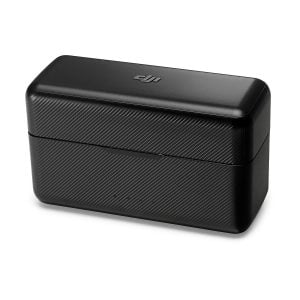 Black rectangular DJI Mic Dual Kit wireless microphone system charging case with textured surface and rounded edges against a white background.