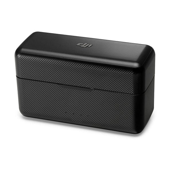Black rectangular DJI Mic Dual Kit wireless microphone system charging case with textured surface and rounded edges against a white background.