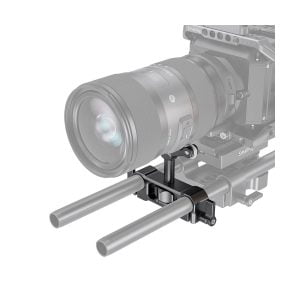 A camera with a large lens is mounted on a SmallRig 2727 Universal Lens Support LWS 15mm Rod Mount with two parallel rods and a lens support bracket underneath for stability. The background is white.
