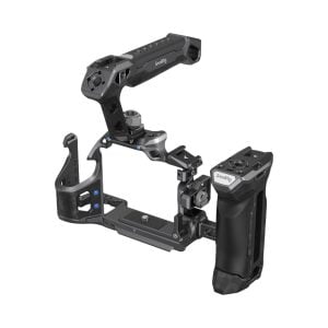 The SmallRig 3710 Rhinoceros Advanced Cage Kit for Sony A7 RV/A7 VI/A7 SIII is a black camera cage with a top handle, side handle and multiple attachment points designed to hold the camera securely in place and protect it while shooting.
