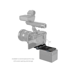 The SmallRig 4064 Compact V-Mount battery mounting system is pictured attached to the camera. The mount swivels 180° back and 90° forward for easy access to the LCD screen, as illustrated by the curved arrows, for convenient storage and viewing.