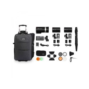 The Godox AD-K1 Three Light Kit (AD300Pro & 2xAD100Pro) includes a mobile black carrying case, three studio lights, power cords, battery packs, light converters, colour gels, reflector, umbrella and various accessories neatly arranged.