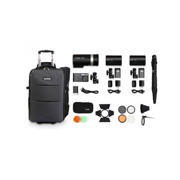 The Godox AD-K1 Three Light Kit (AD300Pro & 2xAD100Pro) includes a mobile black carrying case, three studio lights, power cords, battery packs, light converters, colour gels, reflector, umbrella and various accessories neatly arranged.