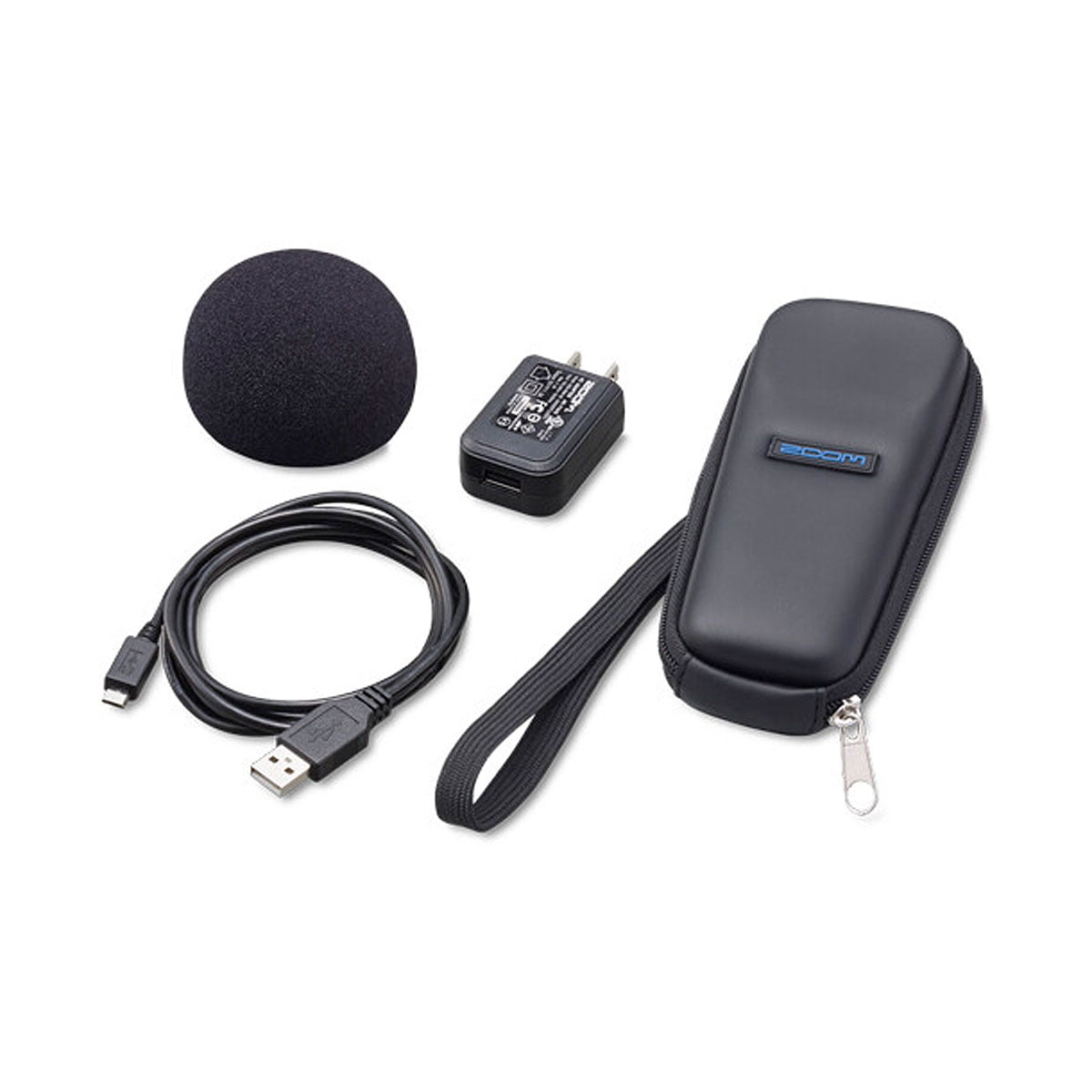 Zoom SPH-1n - Varustepaketti H1 Tallentimelle sisältää mustan vaahtomuovisen tuulisuojan, USB-kaapelin, seinäadapterin ja mustan vetoketjullisen kantolaukun, jossa on rannehihna valkoisella pohjalla.