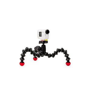 JOBY GorillaPod Action GoPro Jalusta, pieni valkoinen toimintakamera, joka on asennettu joustavaan mustaan jalustaan, jossa on neljä taipuisaa jalkaa ja punaiset kumijalat, näkyy tavallista valkoista taustaa vasten.