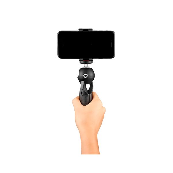 Käsi, joka pitää JOBY HandyPod Mobile Jalusta Puhelimelle Musta, jonka päälle on asennettu älypuhelin, eristetty valkoiselle taustalle.