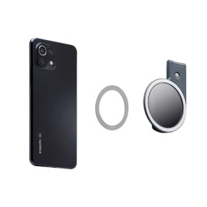 Harmaan Joby Beamo Ring Light for MagSafe on esillä valkoista taustaa vasten yhdessä mustan älypuhelimen ja pyöreän magneettipuhelinpidikkeen kanssa, jossa on klipsi.