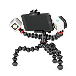 The Joby GorillaPod Mobile Rig has bendable legs and holds a smartphone and two small LED lights - one on each side with red rings - for portable shooting.