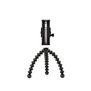 JOBY GripTight GorillaPod Stand Pro Tabletille on kompakti musta kolmijalka, jossa on taipuisat, taivutettavat jalat ja älypuhelimen kiinnike, joka seisoo pystyssä valkoista taustaa vasten.