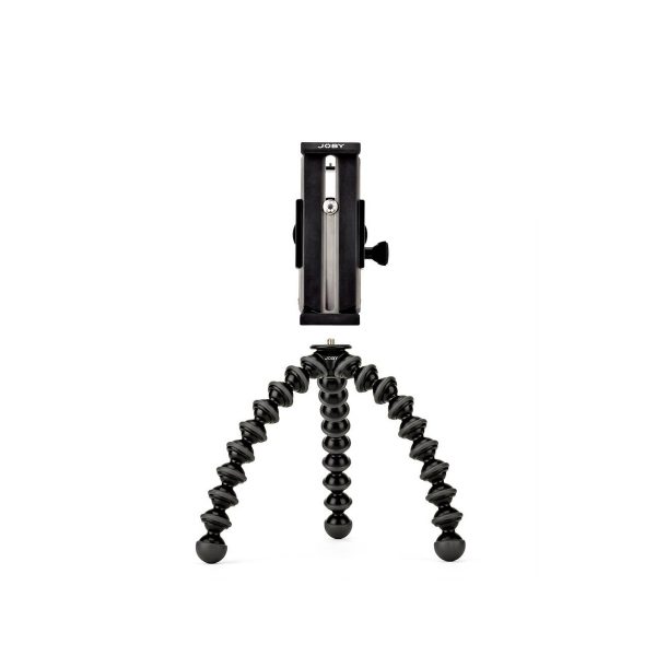 JOBY GripTight GorillaPod Stand Pro Tabletille on kompakti musta kolmijalka, jossa on taipuisat, taivutettavat jalat ja älypuhelimen kiinnike, joka seisoo pystyssä valkoista taustaa vasten.