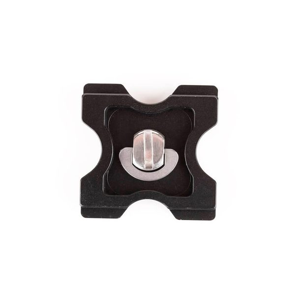 The Joby QR Plate 5K is a black, X-shaped metal quick release plate with a silver fixing screw in the middle, shown from above on a white background.