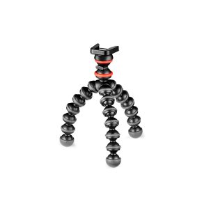 JOBY GorillaPod Starter Kit on joustava mustapunainen kolmijalkainen jalusta, jossa on kolme taivutettavaa, segmentoitua jalkaa ja puhelimen pidike, kuvassa pystyasennossa valkoisella pohjalla.