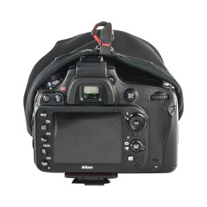 Rear view of a Nikon DSLR camera with Peak Design Shell Protective Cover for Camera - A small rain cover is partially retracted over the top, revealing buttons, dials, LCD screen and viewfinder.