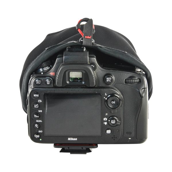 Rear view of a Nikon DSLR camera with Peak Design Shell Protective Cover for Camera - A small rain cover is partially retracted over the top, revealing buttons, dials, LCD screen and viewfinder.