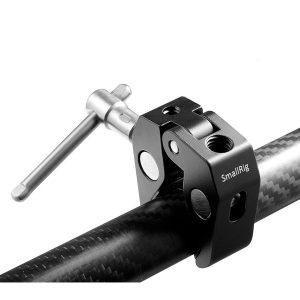 The black SmallRig 2058 Super Clamp with silver handle is attached to a carbon fibre rod for attaching camera accessories; it has 1/4" and 3/8" threads.
