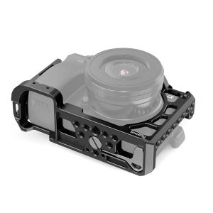 The SmallRig 2310 Cage for Sony A6100/6300/6400/6500 is a black metal cage with multiple mounting points and a protective frame, pictured here housing a Sony Alpha mirrorless camera and lens.