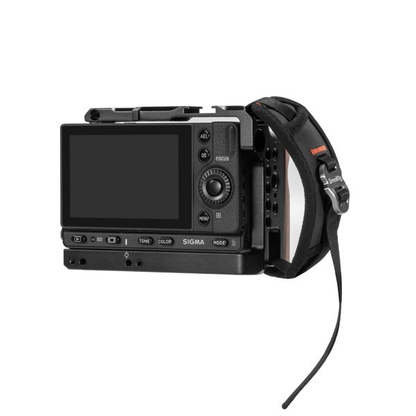 Black SIGMA digital camera with large display, multiple control buttons and a hand strap on the side marked "SmallRig 2456 Hand Strap".