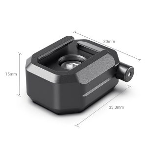 SmallRig-2797-3 SmallRig 2797 Multifunction Cold Shoe Mount w/ Safety Release on musta, suorakulmainen kameran lisävaruste (30mm x 15mm x 33,3mm), jossa on pyöristetyt reunat, keskellä oleva aukko ja sylinterinmuotoinen sivukiinnike.